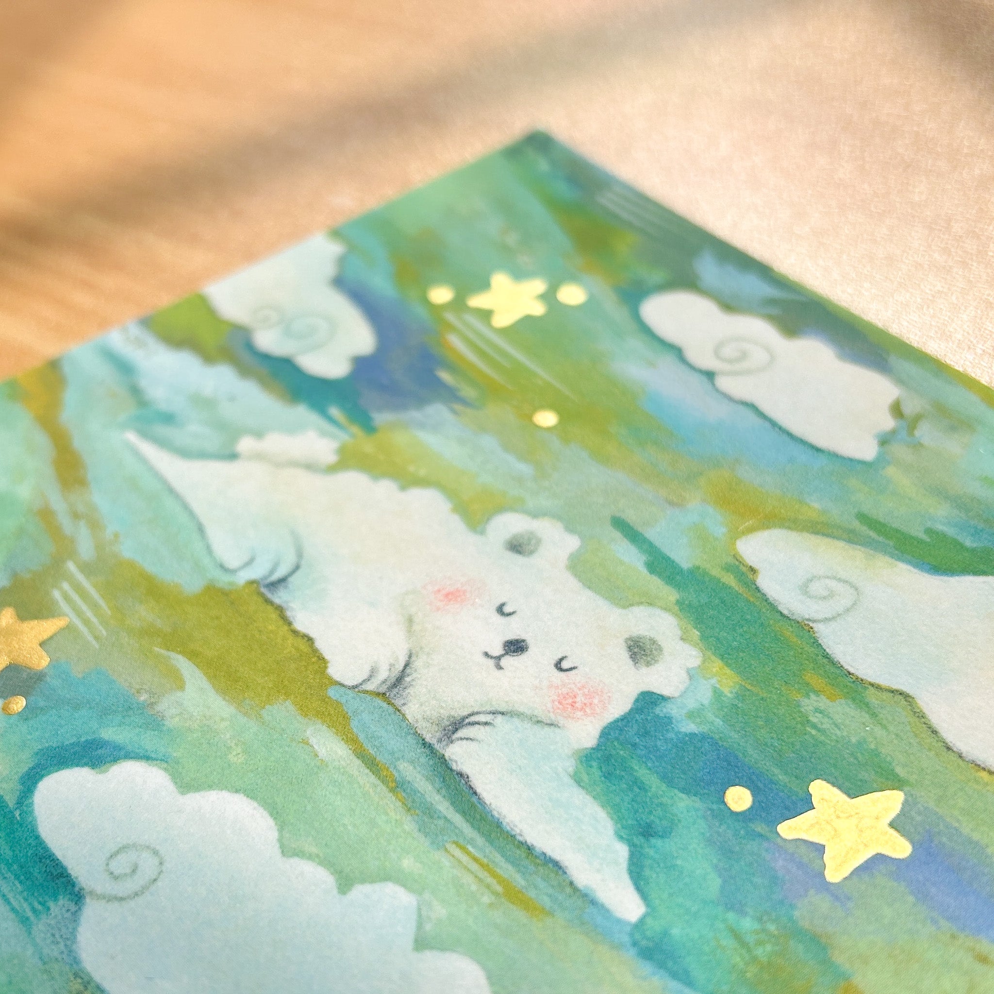 Photo of a cloud bear with hand-painted gold stars art print
